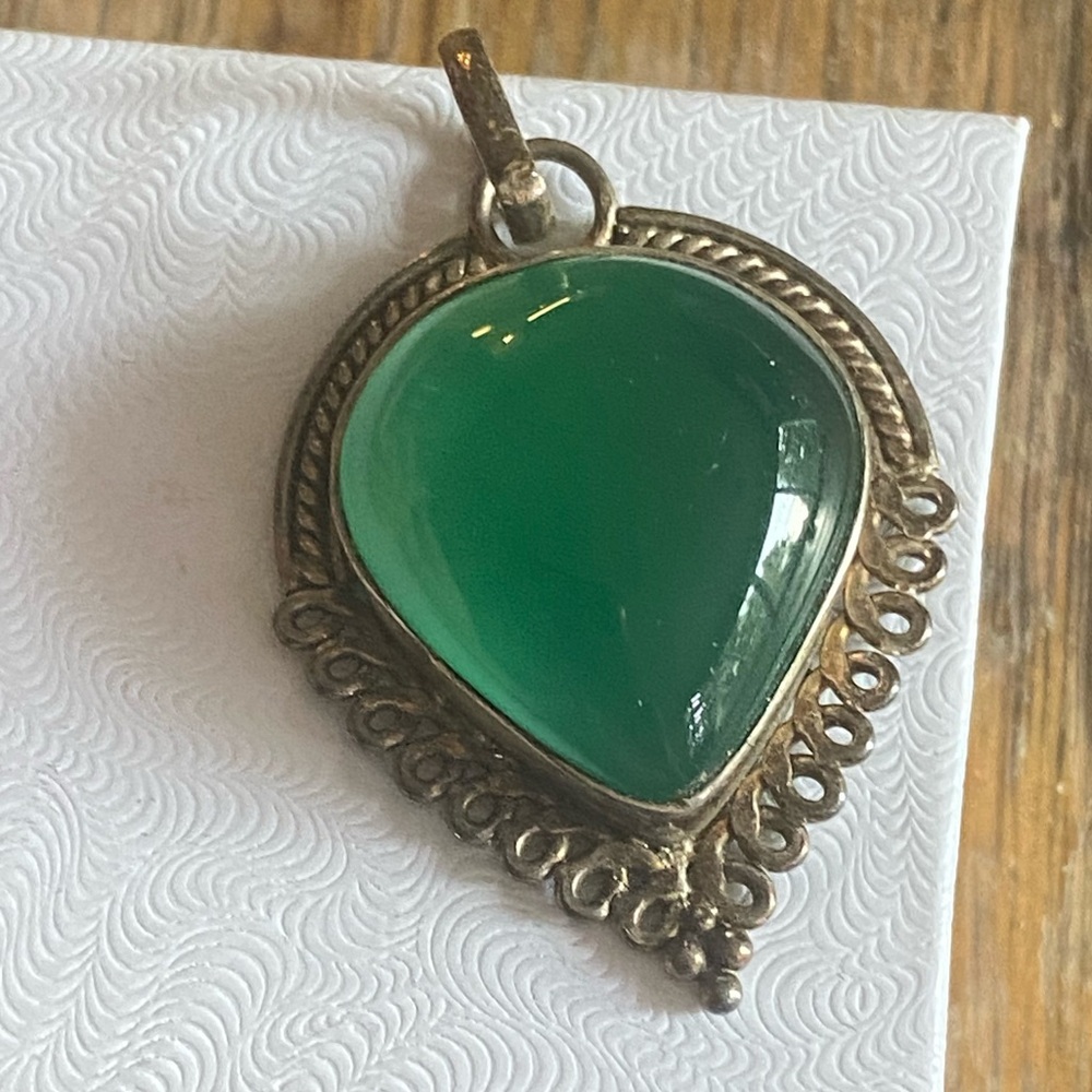 Green stone in sliver setting